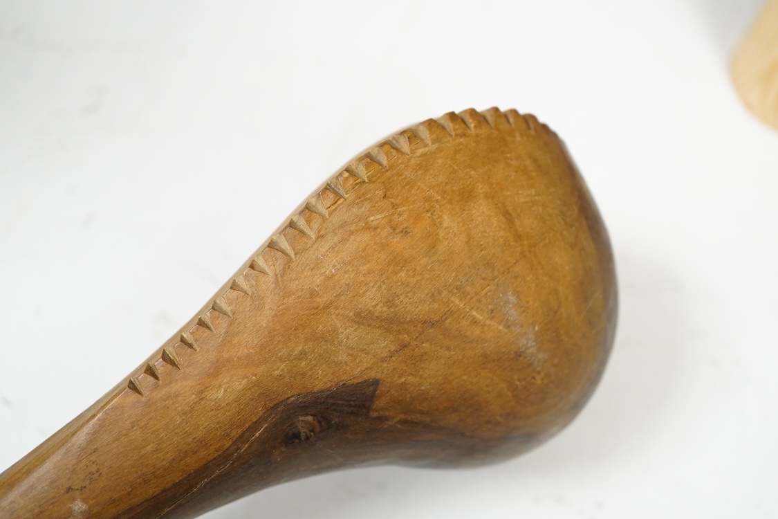 An African hardwood throwing club together with a painted mask and a Caucasian style dagger kindjal, largest 34cm high